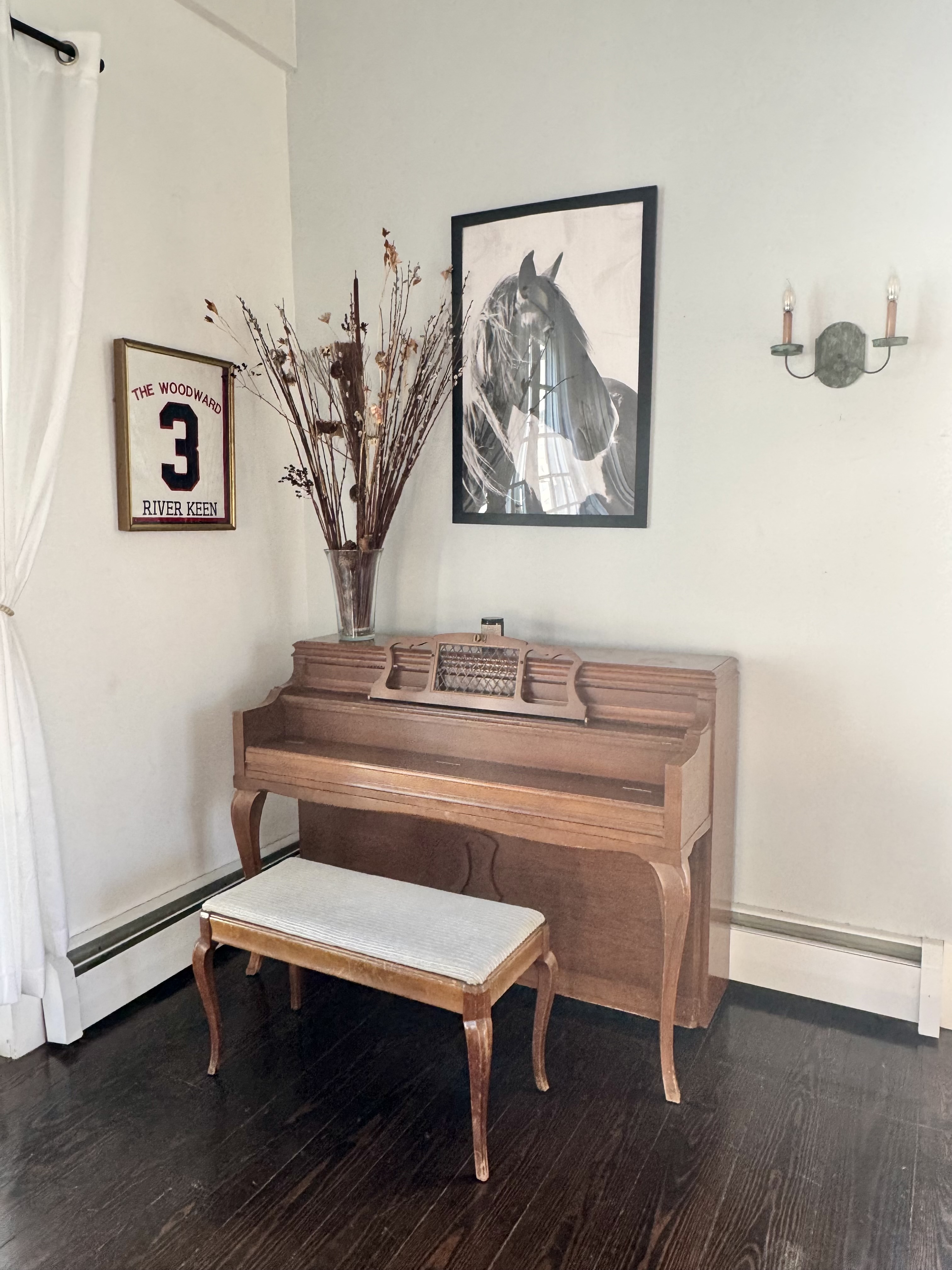 Piano corner beneath cathedral beams
