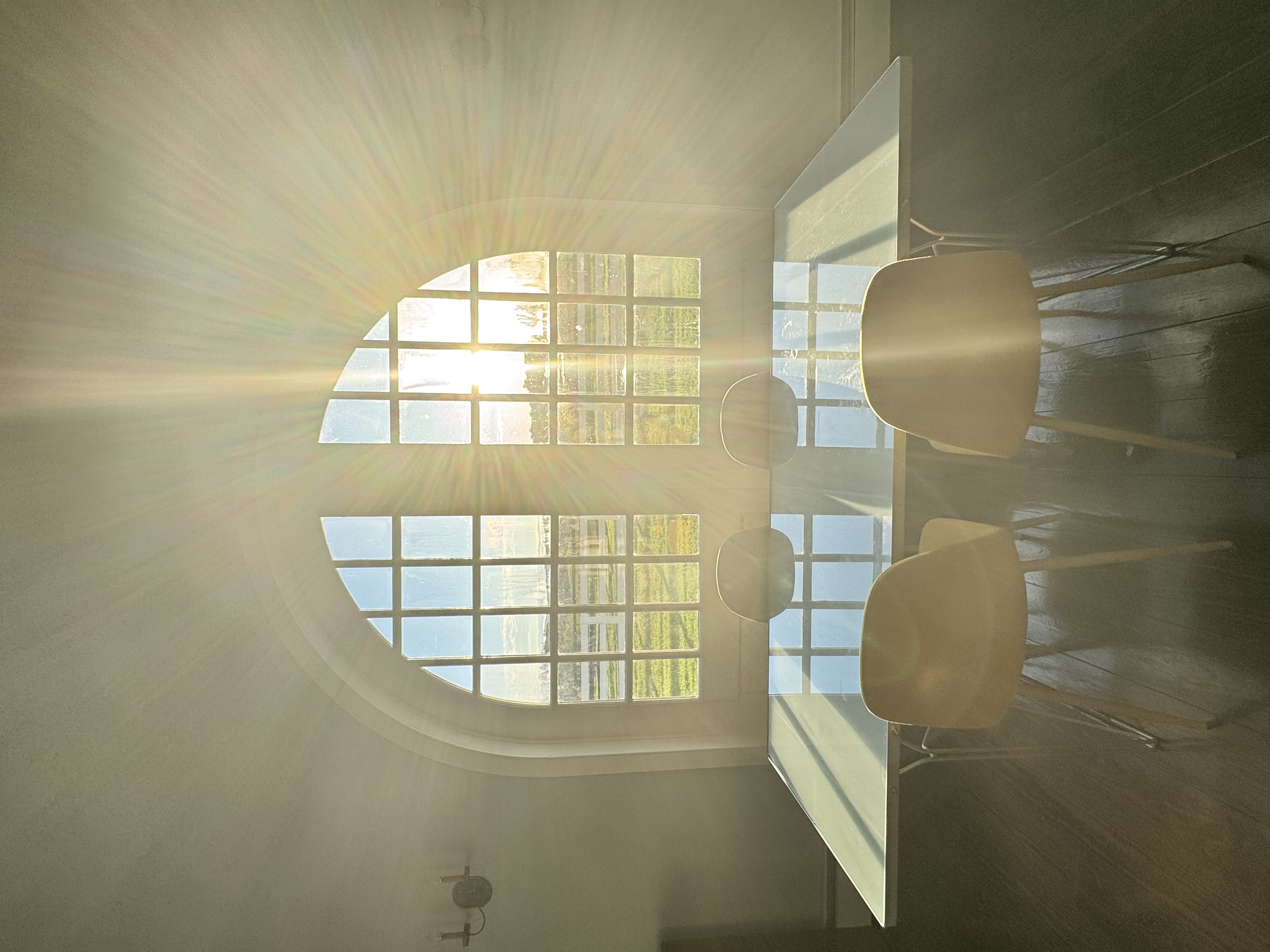 Sunburst through the grand arched window