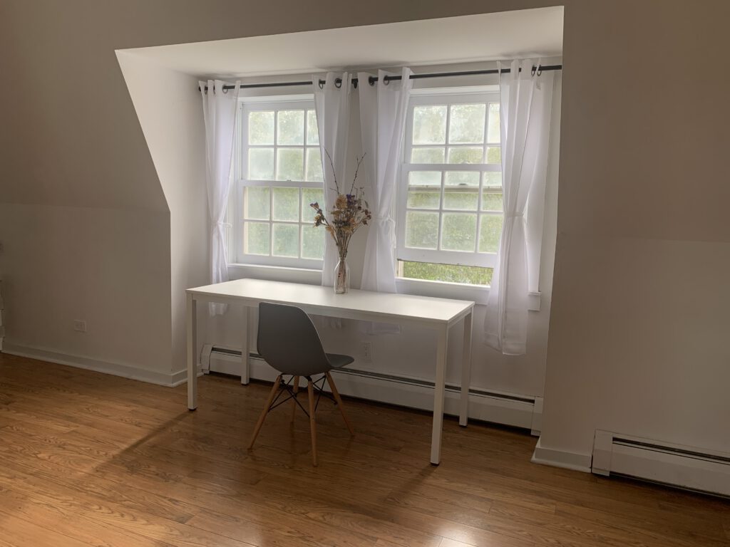 Writing desk and windows overlooking the farm